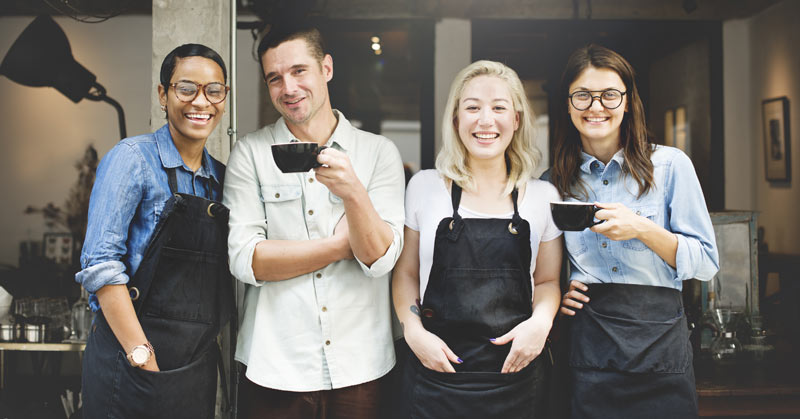 living wage baristas outside a coffee shop happy not in poverty | GROSCHE