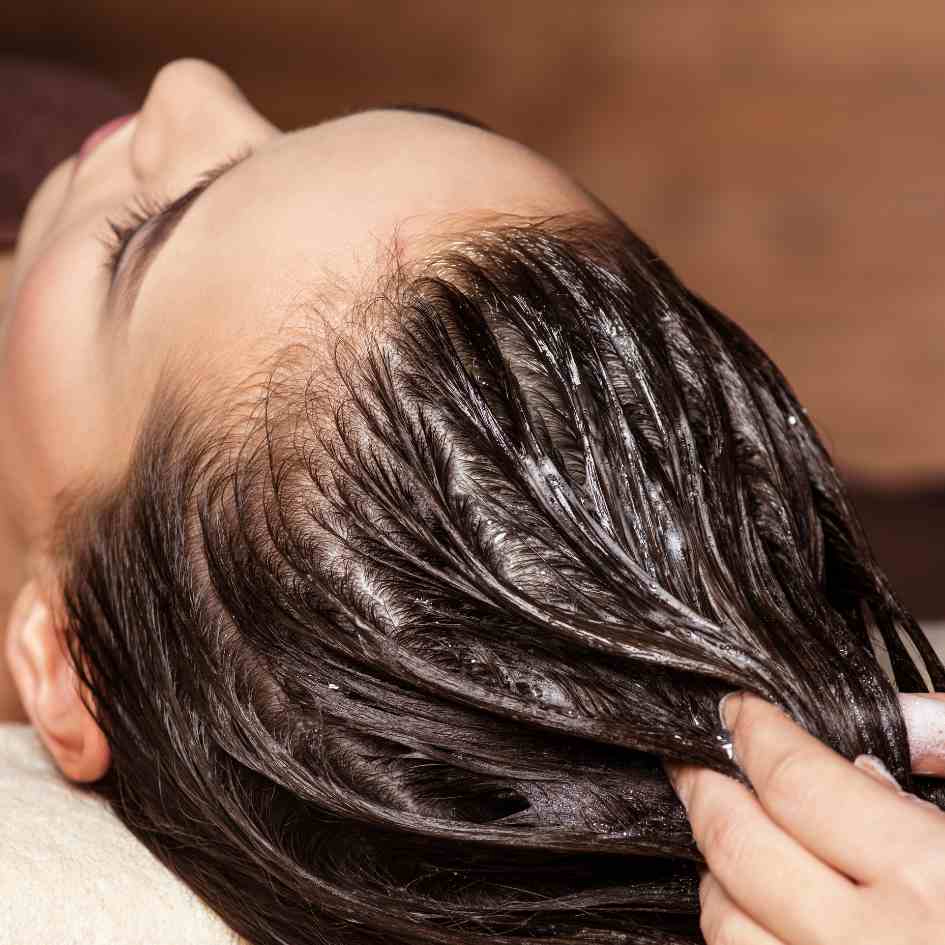 Image of someone washing their hair