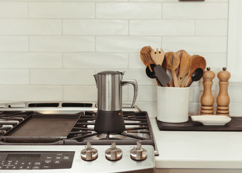 MILANO STEEL Brushed Stainless Steel Moka Pot sitting on stovetop.